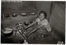 Gita, age 22, cooking in a room without ventilation.